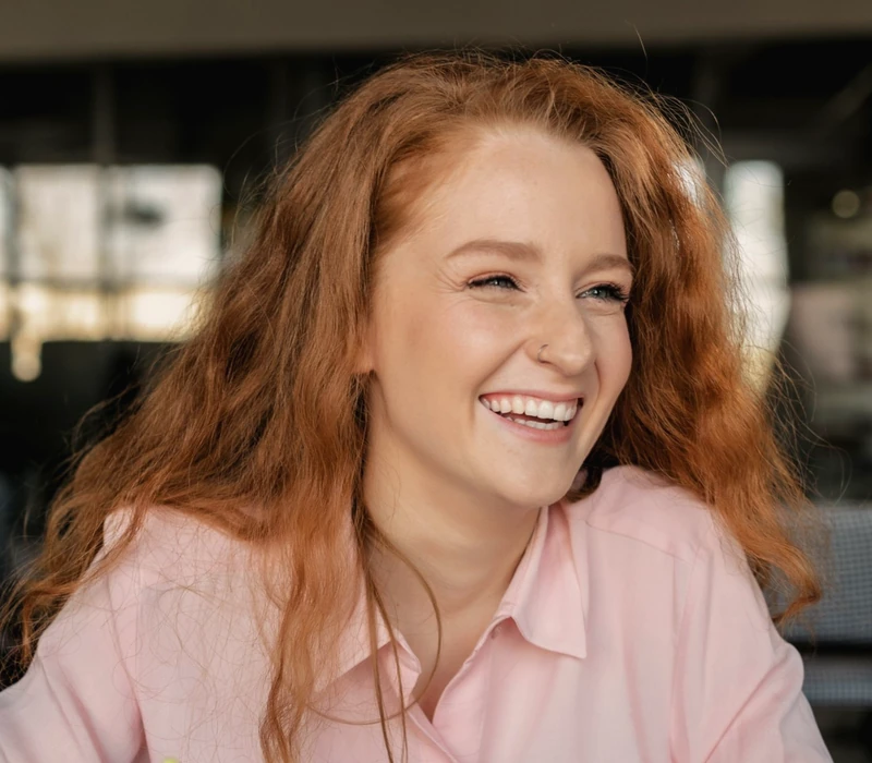 Employee laughing at her laptop